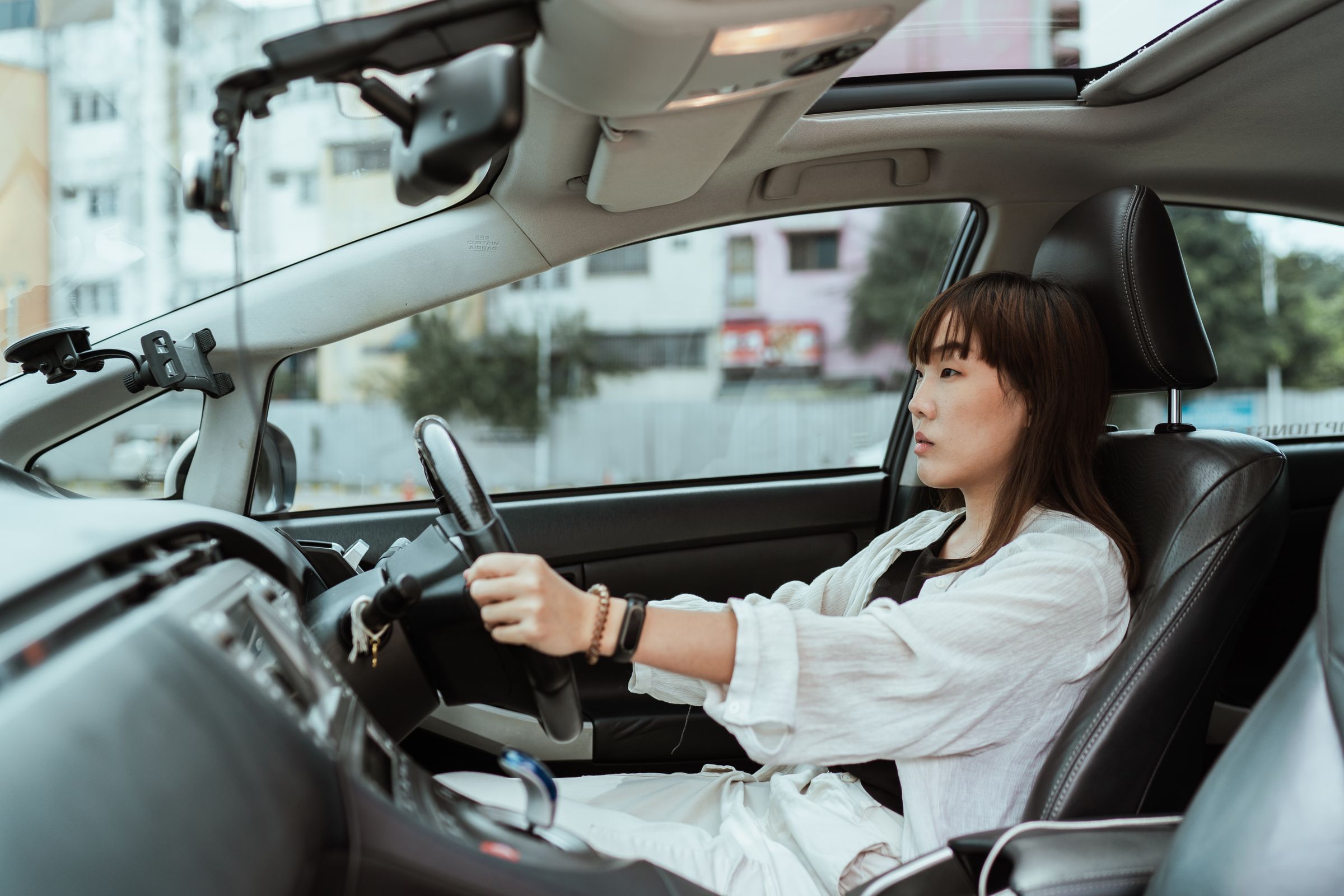 A doctor drives between clinics